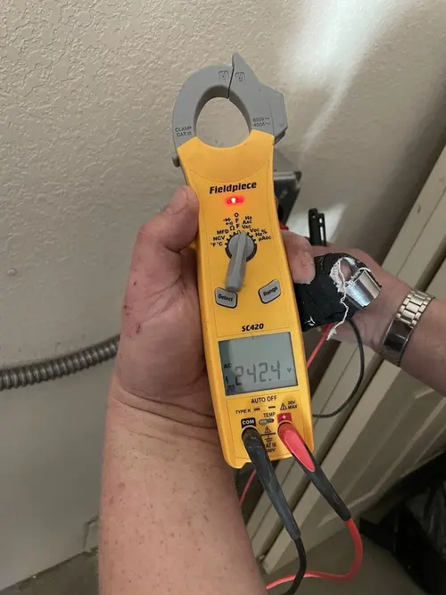 Voltage testing with clamp meter during Whole House Surge Protector in Wesley Chapel